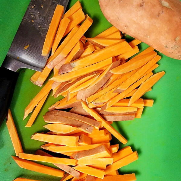 Cut sweet potatoes for fries Cut sweet potatoes for fries